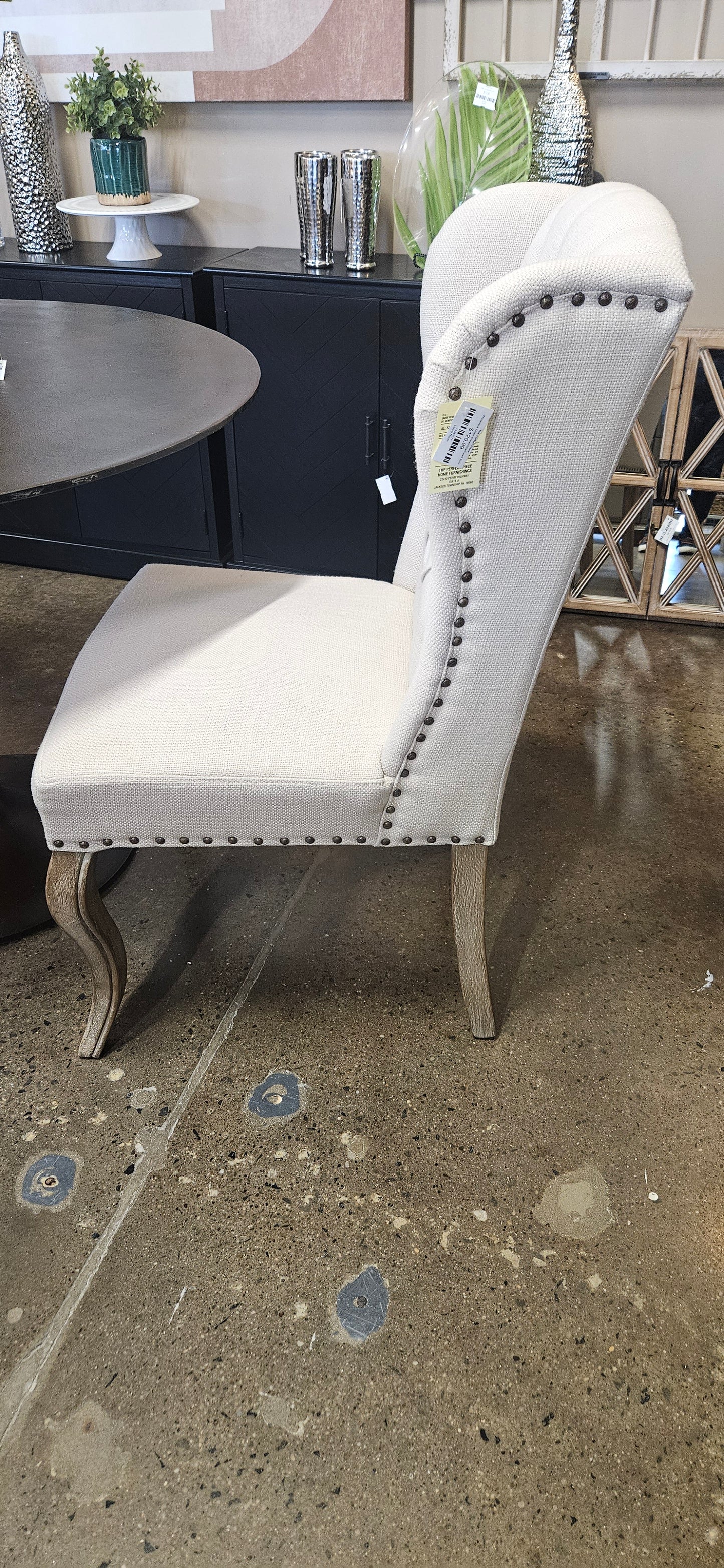 Pier 1 cream wingback tufted chair