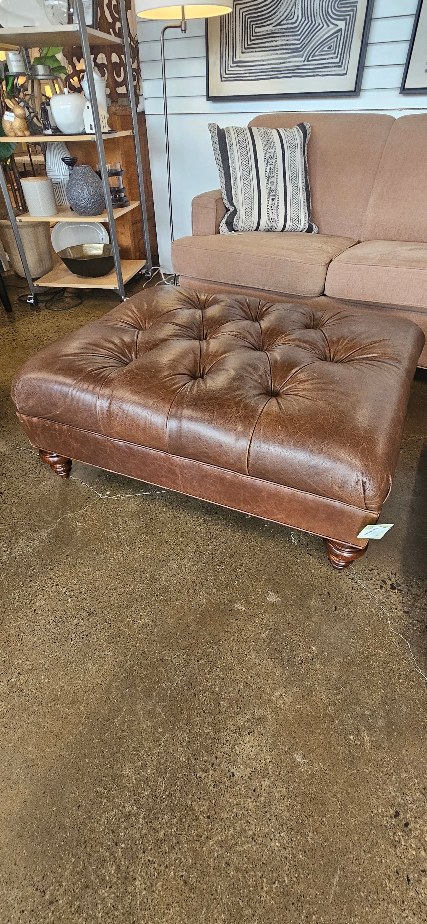 Brown leather tufted ottoman