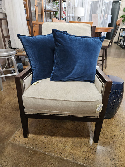 Cream fabric with distressed wood chair