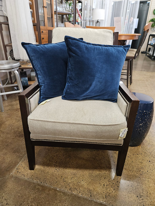 Cream fabric with distressed wood chair