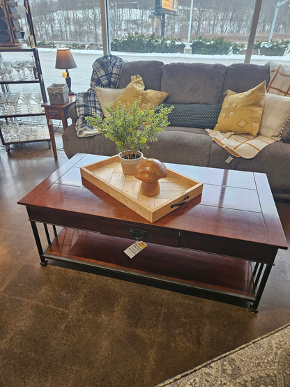 Dark wood coffee table with metal legs and drawer