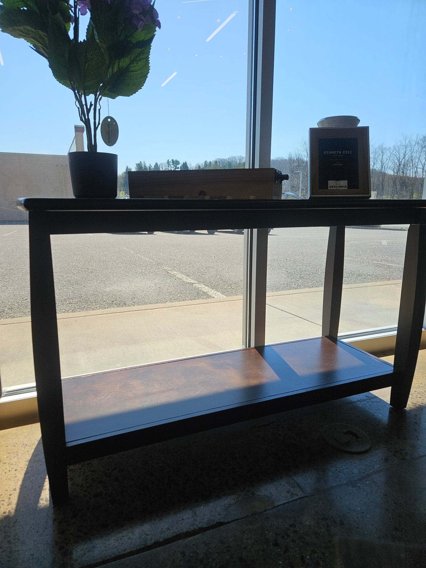 Dark sofa table with bottom shelf
